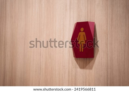 symbol icon women's bathroom icon wooden wall background.