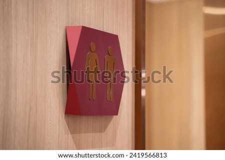 symbol icon male and female bathroom icons wooden wall background.