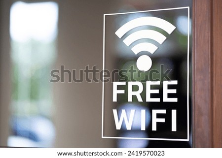 Free wifi icon symbol, wifi signal with wave signal icon on glass background in cafe shop.