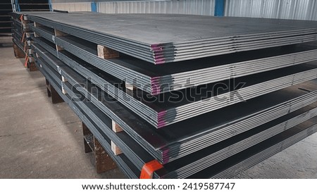 Galvanized steel sheet for background.Group of steel sheets for industrial materials Construction engineering products Factory equipment, pipes metal, industrial warehouse,steel plate structure Royalty-Free Stock Photo #2419587747