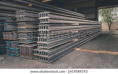 Metal forming steel beams at the metal products warehouse, H-beam steel and Wi-Frank steel. For large structures or building columns, focus only on the raw materials used in building construction. Royalty-Free Stock Photo #2419589193