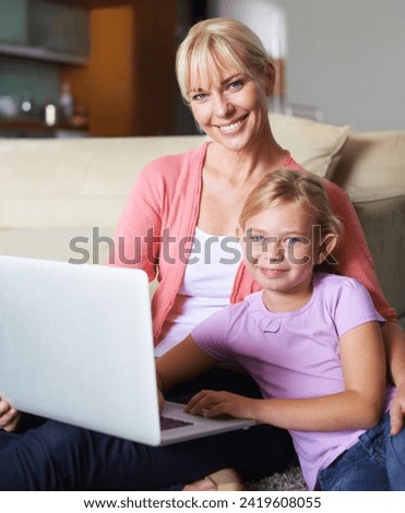 Mother, child and laptop in portrait in living room, happy and streaming subscription in apartment. Daughter, woman and face by computer for online cartoon on couch, technology and connected in house