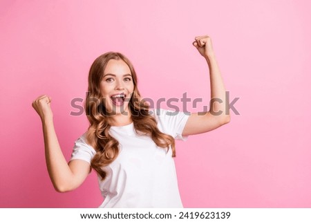 Portrait of young awesome gorgeous model raised fists up winning scream and promoting noname brand sale isolated on pink color background Royalty-Free Stock Photo #2419623139