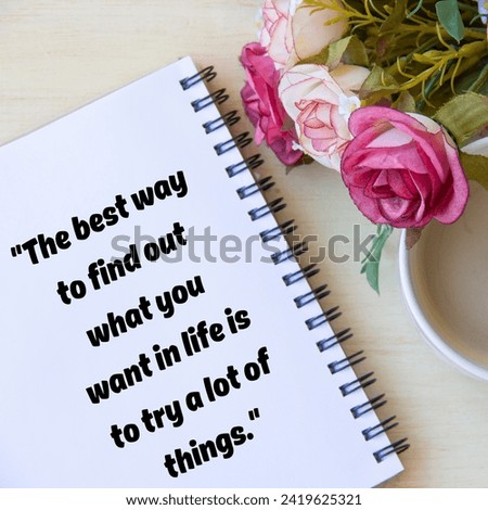 the best way to find out what you want in life is to try a lot of things.notepade,pink, and white flowers  in the background. Royalty-Free Stock Photo #2419625321