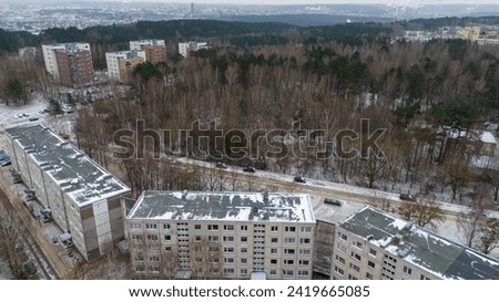 Drone photography of old block multistory houses in a a city during winter cloudy day