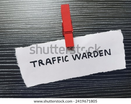 Traffic warden writing on table background.
