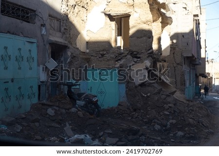 symphony unfolds - Amizmiz in ruins, a ruin rhapsody painted with collapsed edifices, debris-strewn streets, and the haunting crescendo of nature's seismic tale Royalty-Free Stock Photo #2419702769