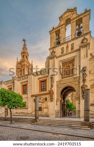 Puerta del Pedon (Door of Forgiveness) with the Giralda tower on the background, Seville, Spain