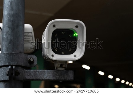 License plate reader, automatic number recognition, digital surveillance camera, boom barrier gate. Smart parking lot entrance pass automation. Vehicle access control. Car park identification system. Royalty-Free Stock Photo #2419719685
