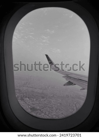 A fine art picture showing the outer view from Pakistan airline plane window seat from Dubai to Lahore