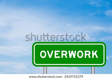 Green color transportation sign with word overwork on blue sky with white cloud background Royalty-Free Stock Photo #2419752379