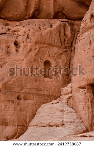 Niche carved into the rock in the city of Hegra. Royalty-Free Stock Photo #2419758087