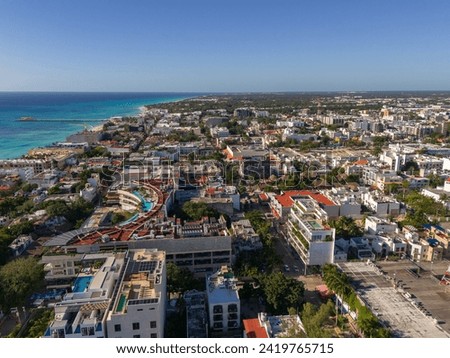 Drone view of downtown area in Playa del Carmen  with blue Caribbean Sea and cloudless blue sky in the morning  Royalty-Free Stock Photo #2419765715