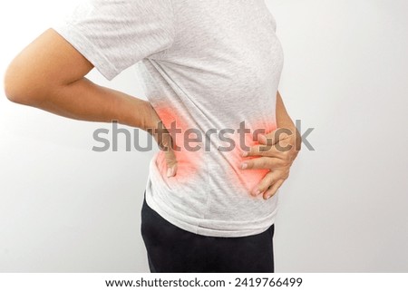 Woman suffering from waist or hip pain on white background. Chronic gastritis, office syndrome and health concept.