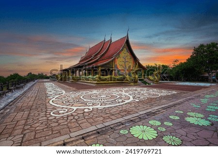 Ubon Ratchathani,Amazing Temple Sirindhorn Wararam Phuproud in Ubon Ratchathani Province at twilight time,Thailand.Thai temple with grain and select white balance