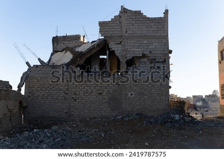  the echoes of catastrophe in Amizmiz - a post-earthquake narrative captured through damaged buildings, debris-laden streets, and the poignant traces of human resilience Royalty-Free Stock Photo #2419787575