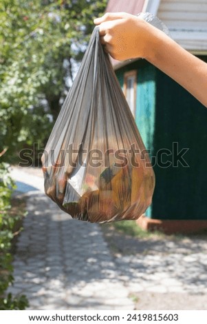 Hand holding Trash, waste, trash recycle bag with garbage