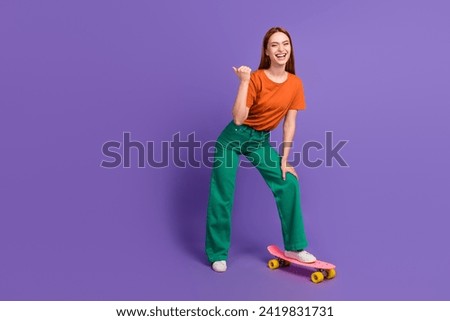 Full length photo of cheerful good mood girl demonstrating empty space seasonal offer sport store isolated on violet color background