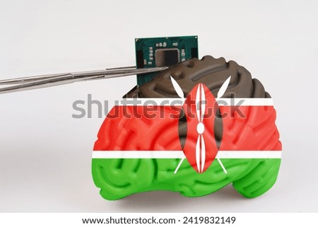 On a white background, a model of the brain with a picture of a flag - Kenya, a microcircuit, a processor, is implanted into it. Close-up