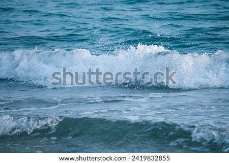 A picture of the sea with calm waves.