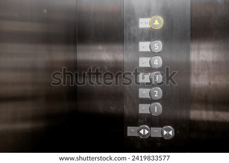 Lift or Elevator buttons and wall inside.Accessible elevator push buttons with numbers.Up and down button in Elevator buttons.