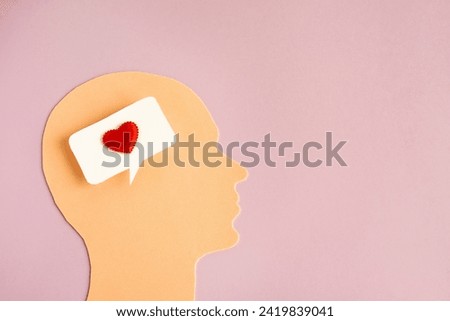 The head of a man with a heart instead of a brain. Happiness and love.