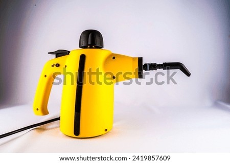 Picture of Yellow Hot Vapor Cleaning Machine