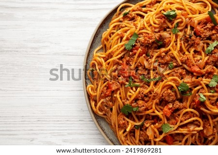 Homemade One-Pot Taco Spaghetti on a Plate, top view. Space for text.