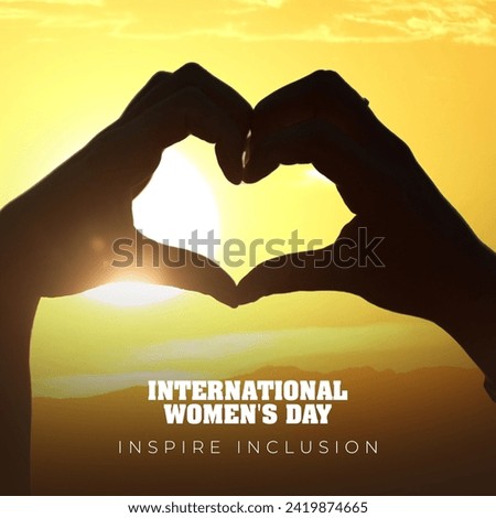 International Women's Day 2024, showing sign of Inspire Inclusion on silhouette background.   Royalty-Free Stock Photo #2419874665