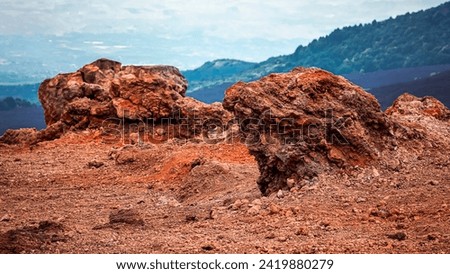 a red rock on a terrace of Etna