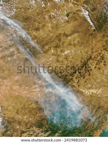 Smoke from Siberian wildfires over China. Smoke from Siberian wildfires over China. Elements of this image furnished by NASA.