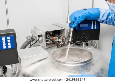 Embryologists a Liquid Nitrogen Bank Containing Sperm and Eggs Samples. ivf  in vitro fertilization, egg freezing. Sperm cryopreservation. Sperm freezing. Royalty-Free Stock Photo #2419888149