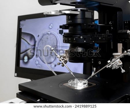 Modern IVF micromanipulator with Petri Dish in the laboratory of the in vitro fertilization. for insemination of the egg freezing. Sperm cryopreservation. Ovum fertilization procedure Royalty-Free Stock Photo #2419889125