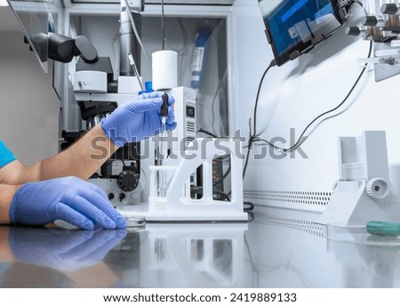Sperm and Eggs Samples - ivf - in vitro fertilization, egg freezing or working with Micro Pipette vaccine, treatment or medicine research. IVF laboratory embryo biotechnology fertility treatment Royalty-Free Stock Photo #2419889133