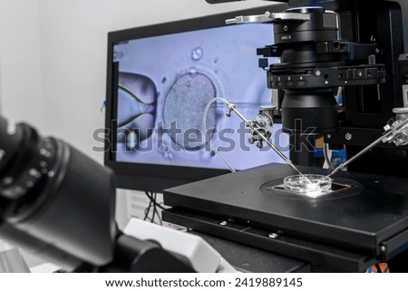 Modern IVF micromanipulator with Petri Dish in the laboratory of the in vitro fertilization. for insemination of the egg freezing. Sperm cryopreservation. Ovum fertilization procedure Royalty-Free Stock Photo #2419889145