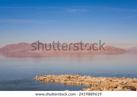Mountains reflected in the Great Salt Lake outside of Salt Lake City, Utah, US. Royalty-Free Stock Photo #2419889619