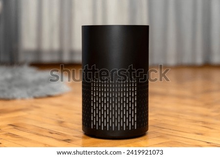Air purifier health technology in cozy modern living room and cleaning removing dust PM2.5, Air purifier for fresh air and healthy life, Health care Air Pollution Concept. clean dust and fresh home Royalty-Free Stock Photo #2419921073