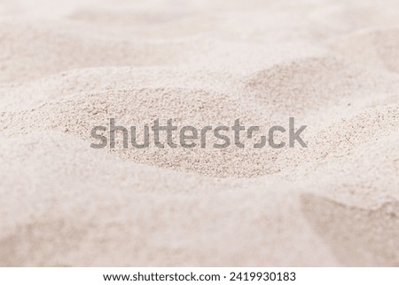 Pink Sand texture natural background. Close up sandy beach  sand on shore sea, waves textured dunes, light color, minimal nature fon. Summer and travel, spa and rest concept. Selective focus.