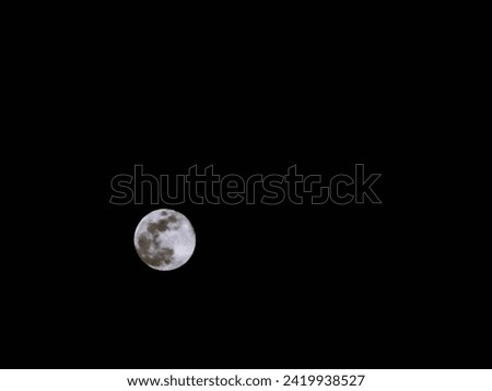 A Monochrome Photo of the Full Moon Taken on 
