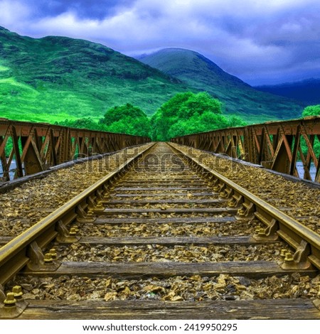 A beautiful background picture of railroad tracks on hills 