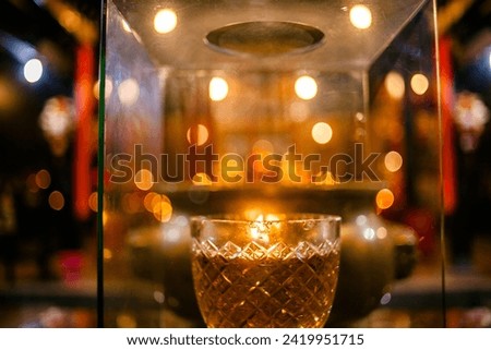 Chinese Worship Altar and Fire on Glasses  inside Tay Kak Sie Temple at Semarang Central Java Indonesia Royalty-Free Stock Photo #2419951715