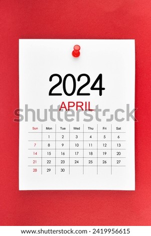 April 2024 calendar page with push pin on red color background.