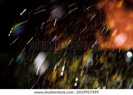 Close-up of freshwater splashing in sunlight with a vibrant rainbow. Abstract, background, surface. Motion blur.