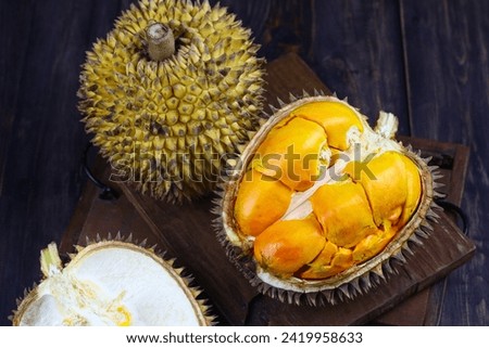 Lai or  Elai fruit, one of Borneo endemic fruits. Family with Durian or Durio fruits. Dark mood photo with wooden background.