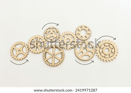 image of spinning gears on a white background