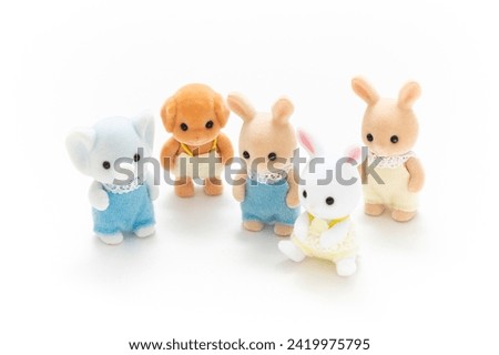 Animal doll isolated on white background. Kids toy. Animal character. Play and learn. Kids room. Childhood. Kindergarten toy. Developmental toys. Tiny dolls. Cartoon character. Cute. Dollhouse. 