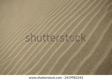 abstract image of line patterns in the sand along a Spanish beach desktop background wallpaper