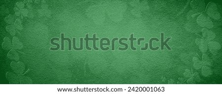 St Patricks day background. Banner of shamrocks over a light green background.