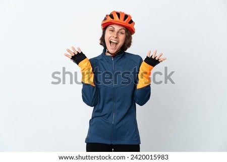 Young English cyclist woman isolated on white background with shocked facial expression