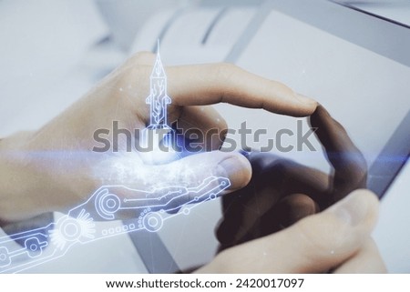 Double exposure of man's hands holding and using a mobile device and creative hologram drawing.